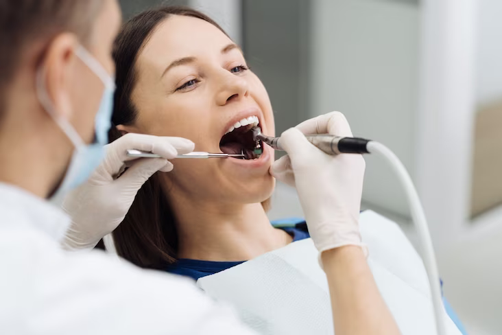 Patient receiving professional dental cleaning and scaling treatment